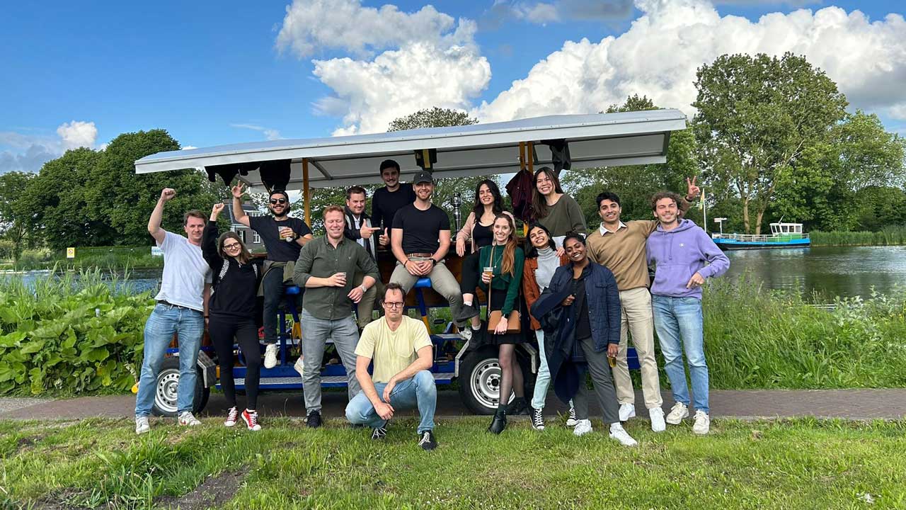 Big student group riding the PedalCity party bike